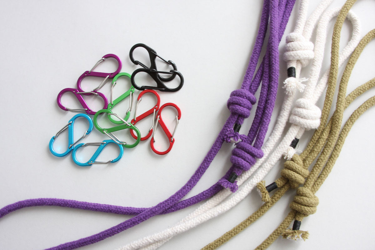 Colour options for the rope and carabiners are shown. There are three rope colours: a military green, white and royal purple. The carabiner colours include: a bright light blue, shamrock green, bright red, electric purpole and black.